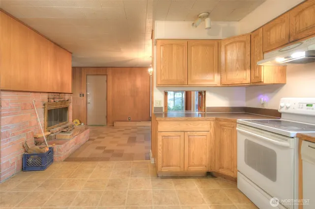 a view of a hallway with wooden shelves