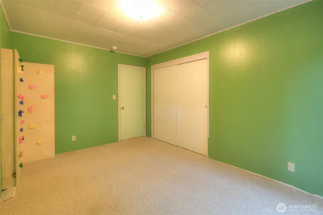 a bathroom with a granite countertop tub a sink and a large mirror