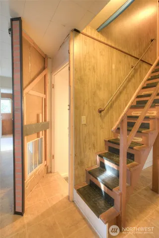 a view of an empty room with a closet