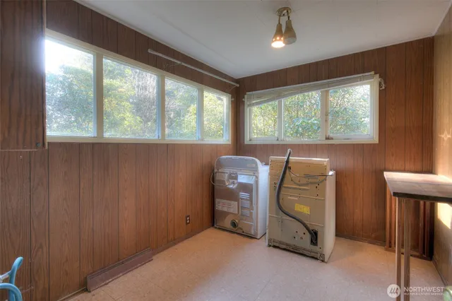 a view of a room with wooden walls