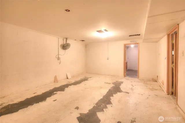 a living room with furniture a window and a table