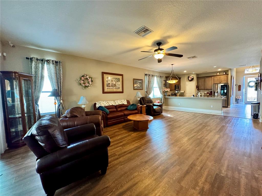 12419 Betony Court New Port Richey, FL 34654 - Photo 5 of 24 a living room with furniture and a wooden floor