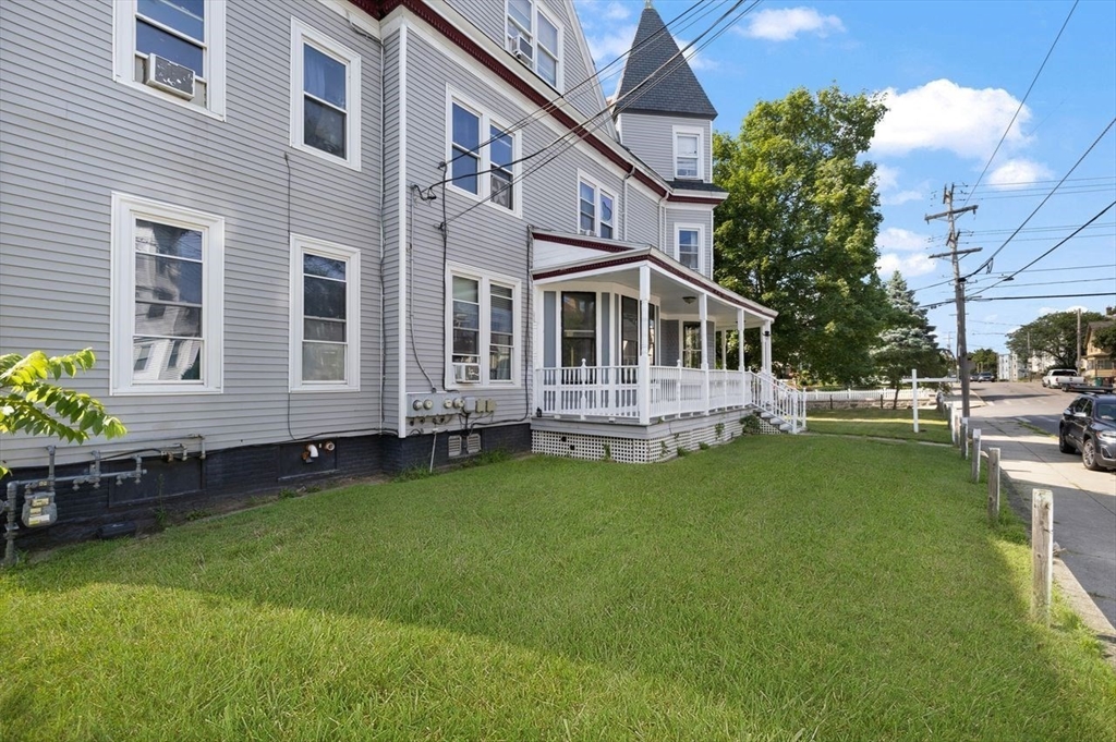 311 Elm Street Woonsocket, RI 02895 - Photo 3 of 29 a front view of a house with garden