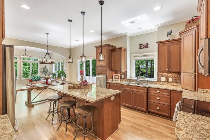 402 Boaters Row Fair Play, SC 29643 - Photo 14 of 50 This expansive kitchen and dining area offers ample space for culinary creativity and entertaining.