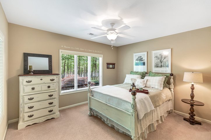 402 Boaters Row Fair Play, SC 29643 - Photo 29 of 50 This tranquil bedroom offers a serene escape with picturesque window views and ample natural light.
