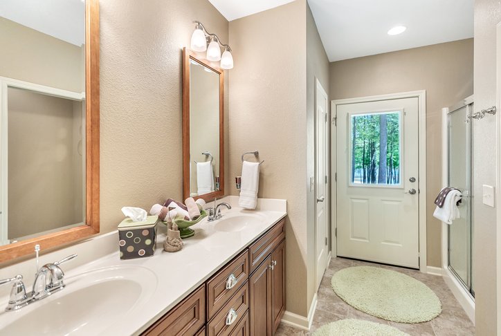 402 Boaters Row Fair Play, SC 29643 - Photo 30 of 50 This bathroom features dual vanities and a glass-enclosed shower, offering comfort and convenience.