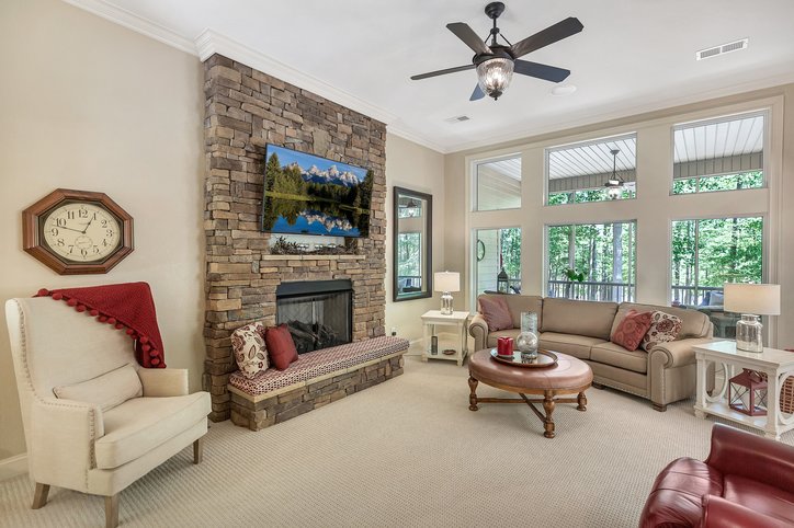 402 Boaters Row Fair Play, SC 29643 - Photo 3 of 50 This inviting living area boasts high ceilings, a cozy fireplace, and abundant natural light.