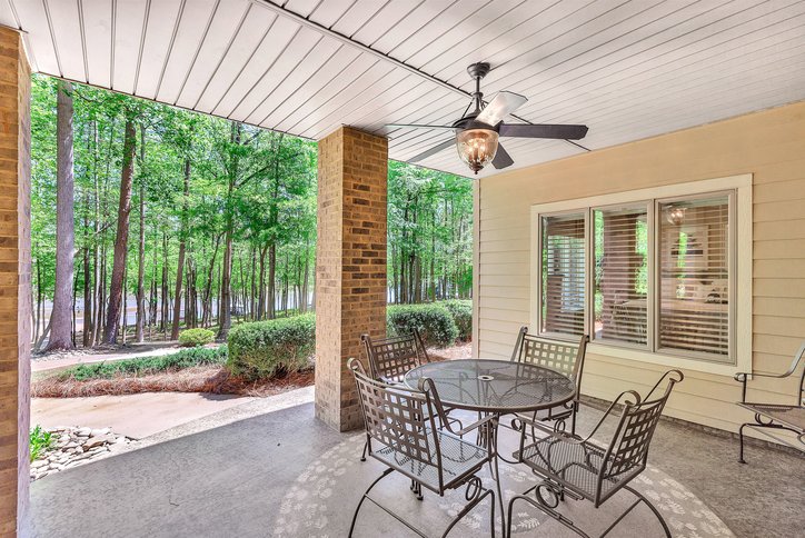 402 Boaters Row Fair Play, SC 29643 - Photo 34 of 50 Enjoy tranquil outdoor living on this expansive patio overlooking lush greenery.