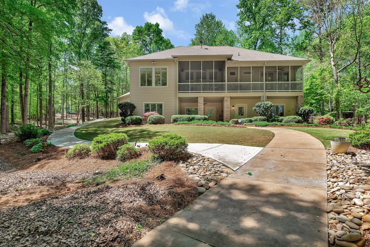 402 Boaters Row Fair Play, SC 29643 - Photo 39 of 50 This residence features ample outdoor living spaces and a lush, verdant setting.
