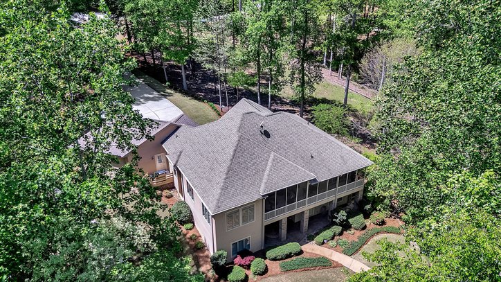 402 Boaters Row Fair Play, SC 29643 - Photo 42 of 50 Perched among lush trees, this home features a covered porch and expansive driveway.