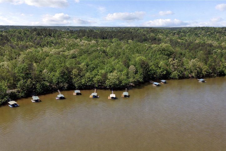 402 Boaters Row Fair Play, SC 29643 - Photo 46 of 50 This aerial view showcases a vibrant waterfront property with ample boat access and lush surroundings.