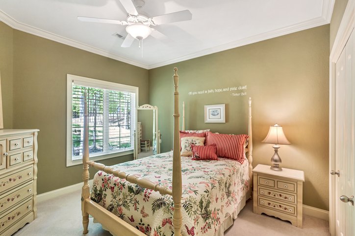 402 Boaters Row Fair Play, SC 29643 - Photo 8 of 50 This inviting bedroom features natural light and crown molding, creating a serene and comfortable retreat.