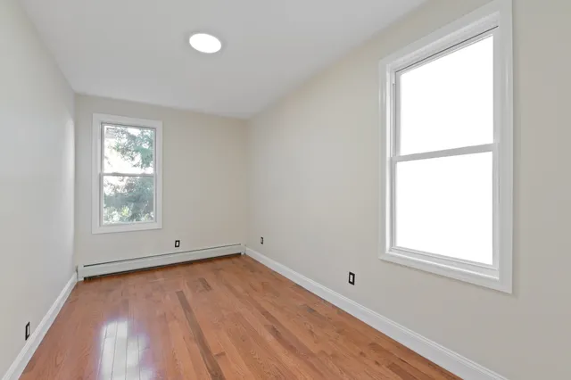 a bathroom with a sink toilet and mirror