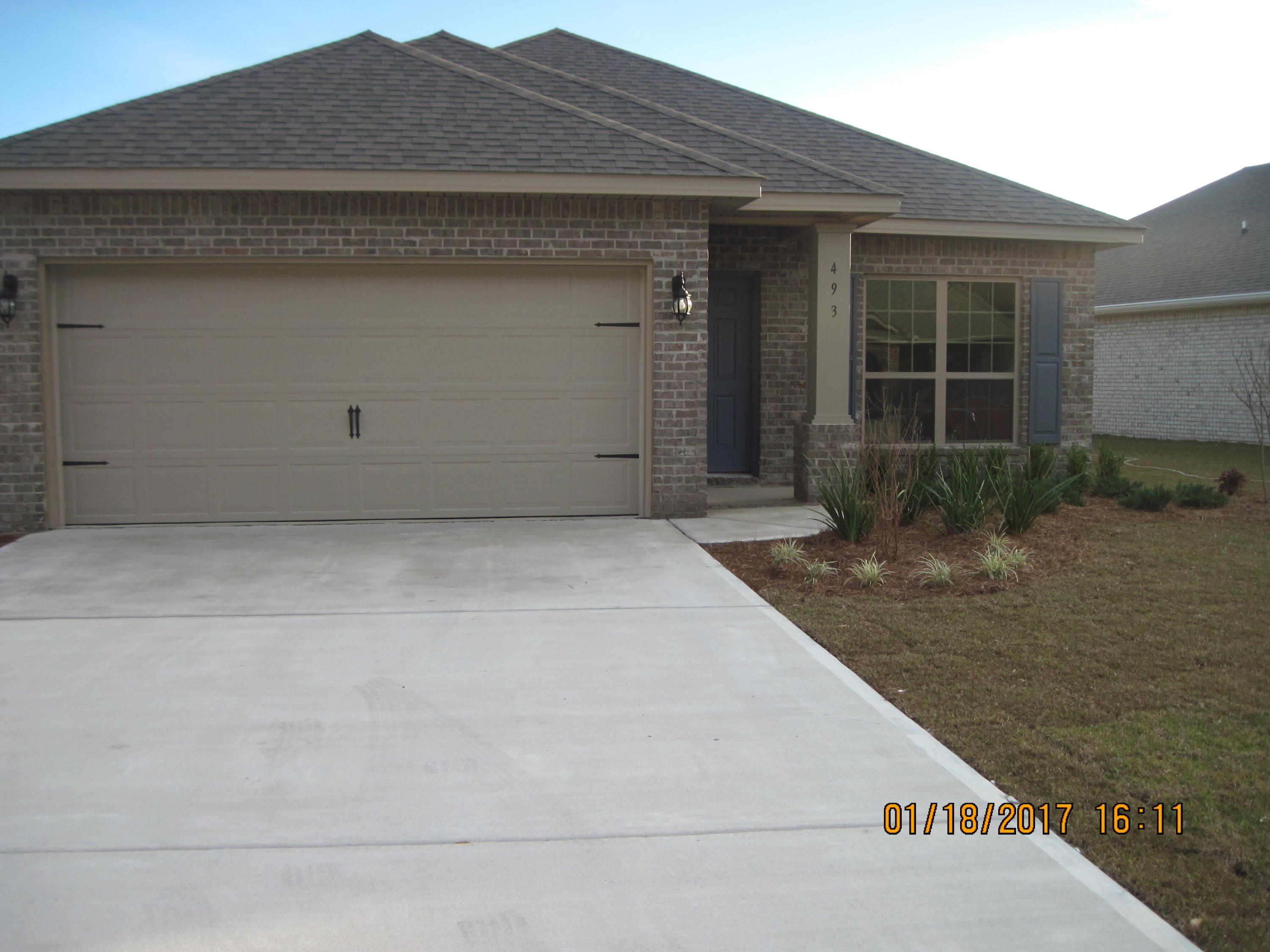 493 Cocobolo Drive Santa Rosa Beach, FL 32459 - Photo 1 of 18 a front view of a house