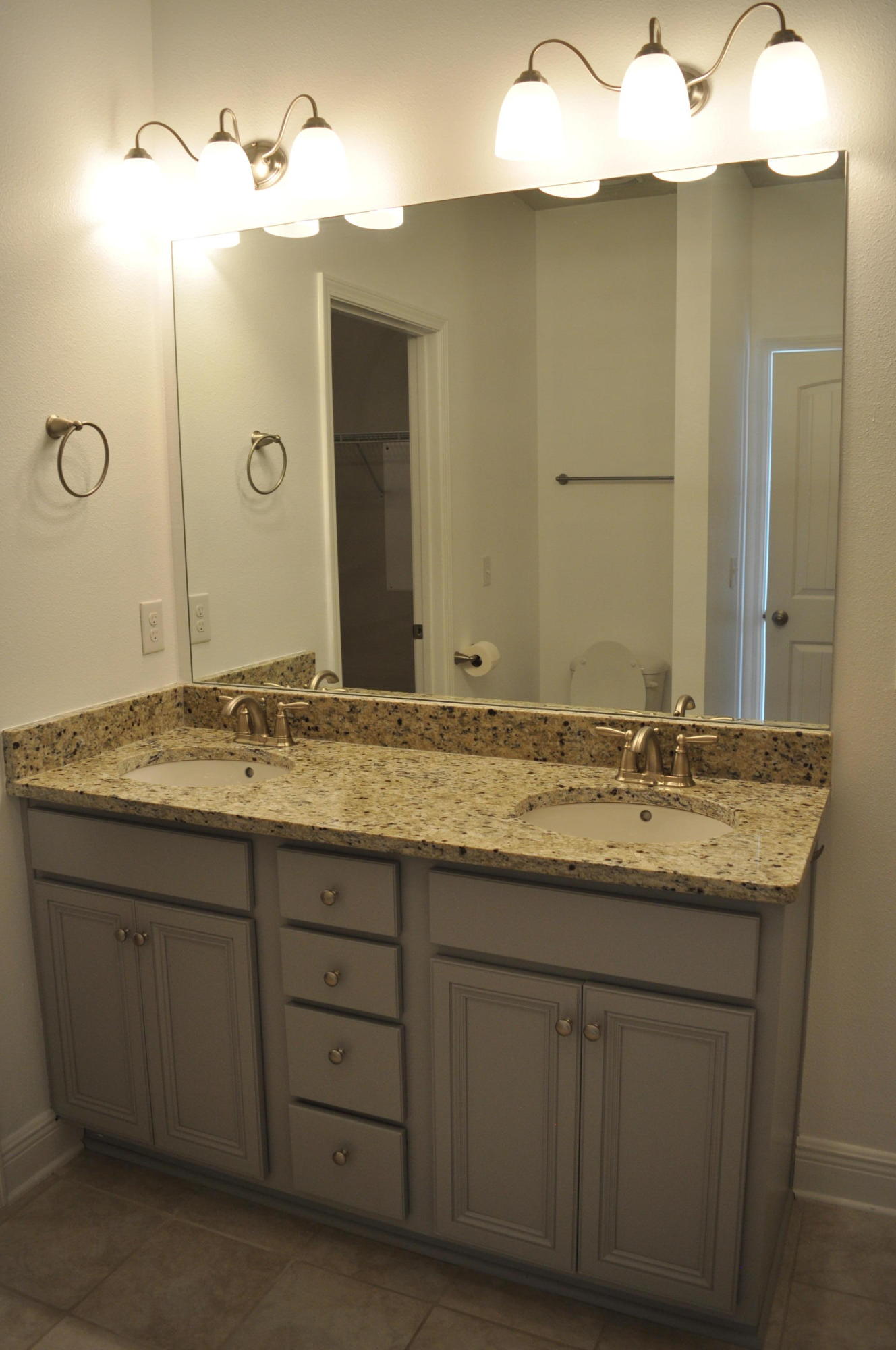 493 Cocobolo Drive Santa Rosa Beach, FL 32459 - Photo 16 of 18 a bathroom with a granite countertop sink and a mirror