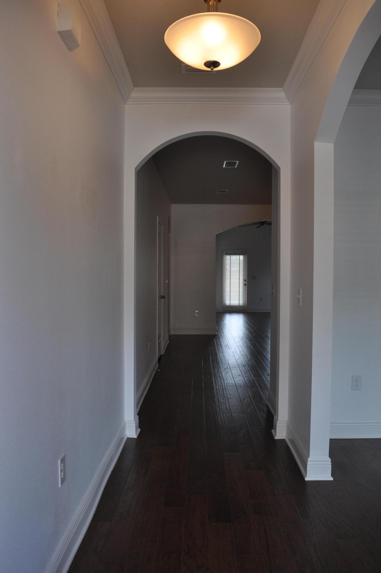 493 Cocobolo Drive Santa Rosa Beach, FL 32459 - Photo 2 of 18 a view of empty room with wooden floor