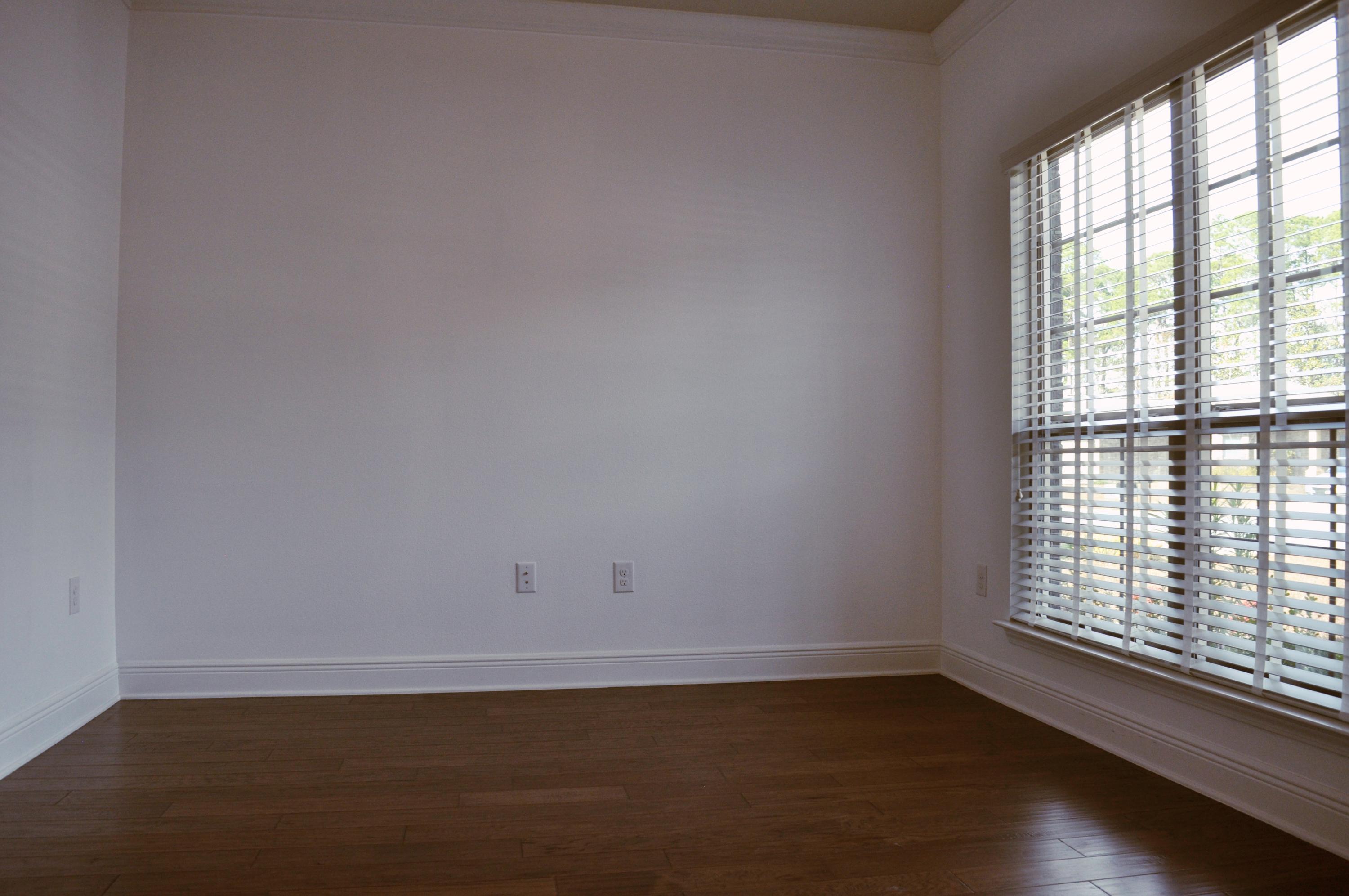 493 Cocobolo Drive Santa Rosa Beach, FL 32459 - Photo 4 of 18 an empty room with wooden floor and windows