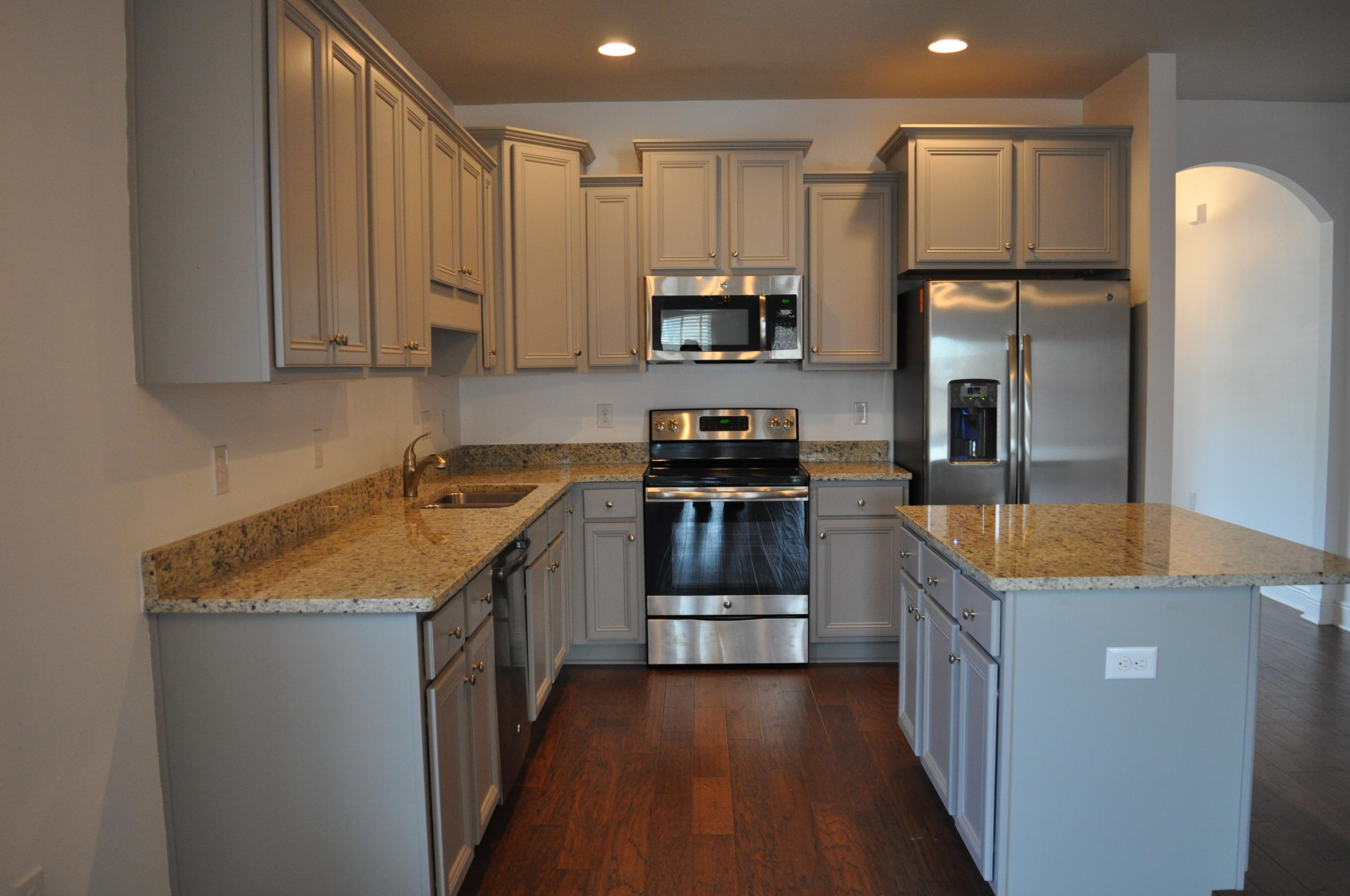 493 Cocobolo Drive Santa Rosa Beach, FL 32459 - Photo 6 of 18 a kitchen with stainless steel appliances granite countertop a kitchen island a stove a sink and a refrigerator