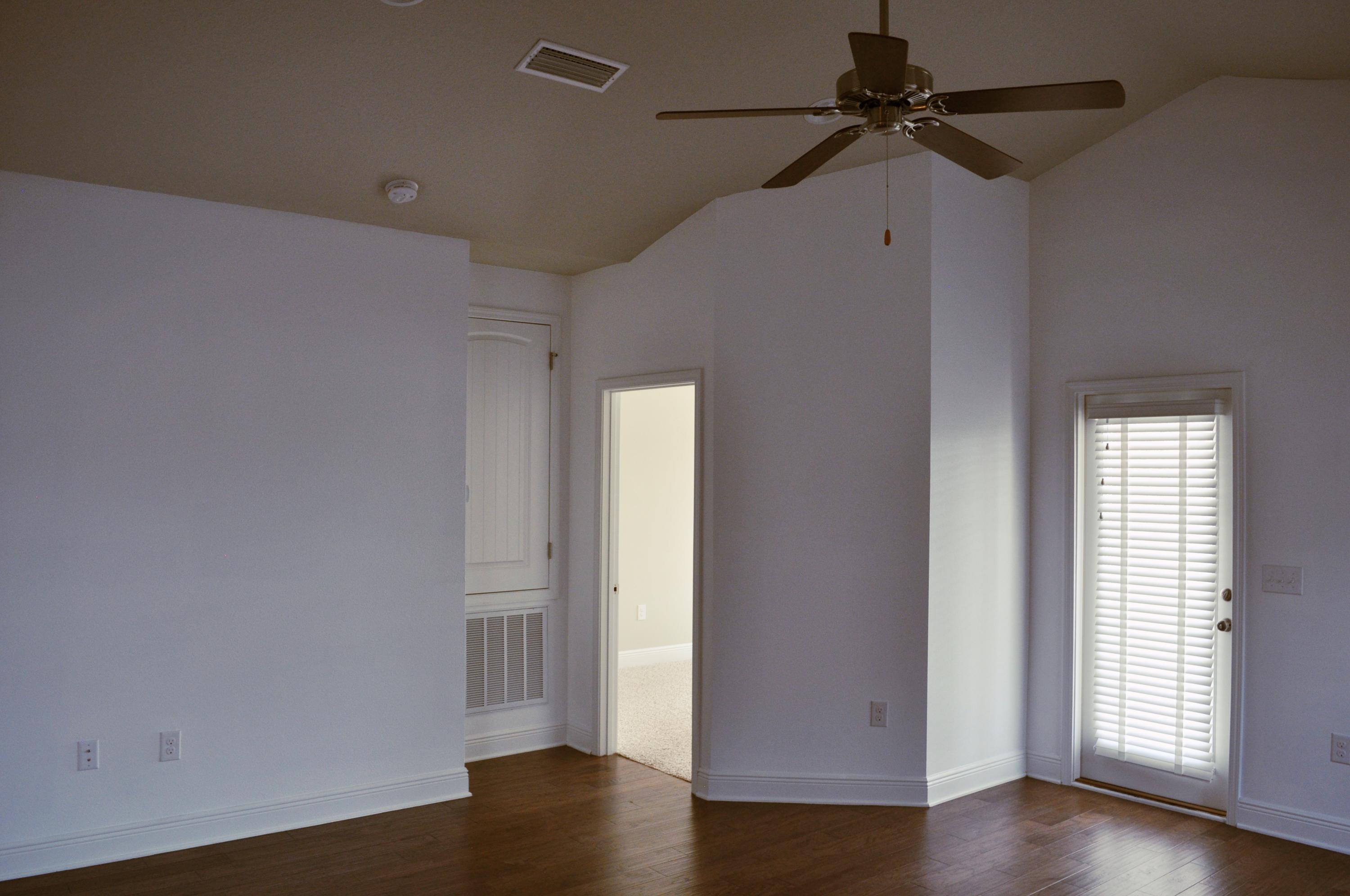 493 Cocobolo Drive Santa Rosa Beach, FL 32459 - Photo 10 of 18 a view of empty room with wooden floor and fan