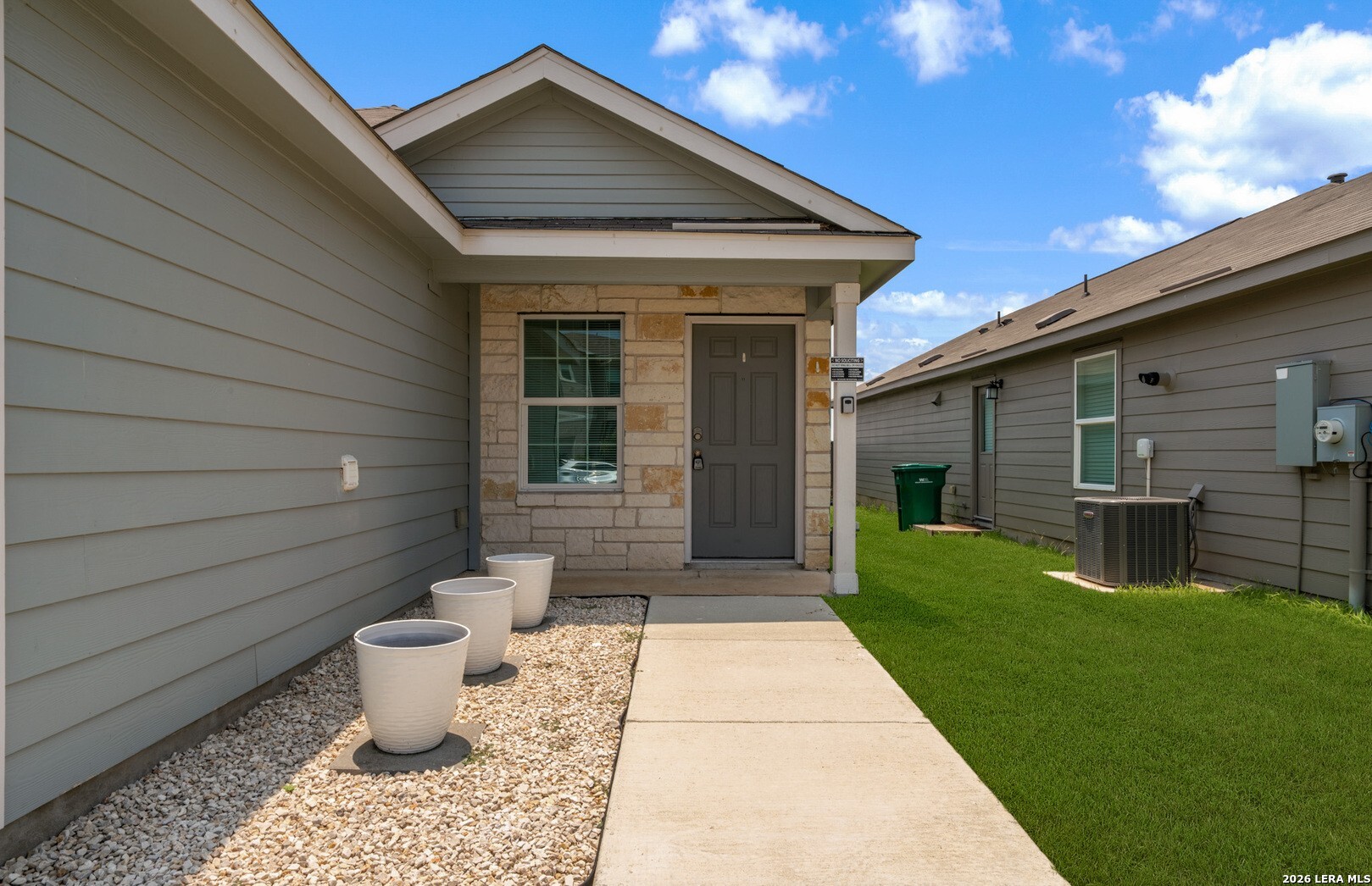 6566 Runaway Row Converse, TX 78109 - Photo 4 of 27 a front view of a house with a yard