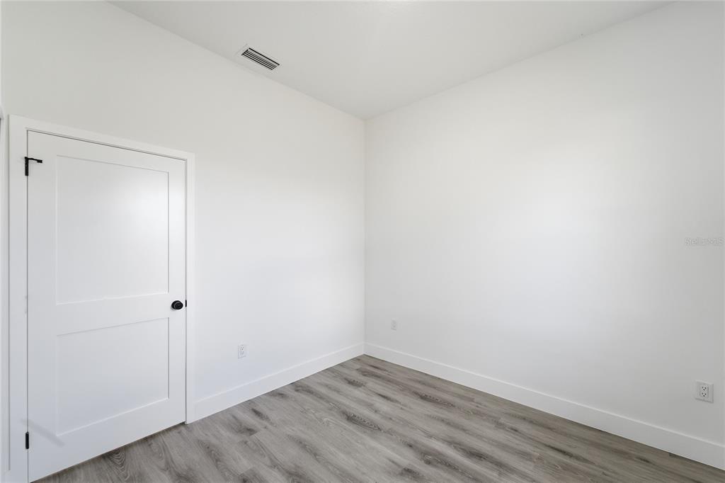 2600 Southwest 146th Pl Road Ocala, FL 34473 - Photo 15 of 40 wooden floor in an empty room