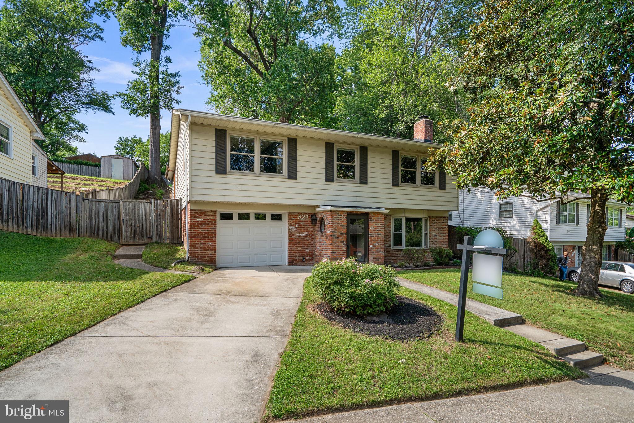 822 Loxford Terrace Silver Spring, MD 20901 - Photo 2 of 61 a front view of house with yard and green space