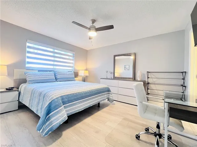 a bedroom with a bed and a cabinets