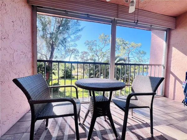a view of a chairs and table in patio