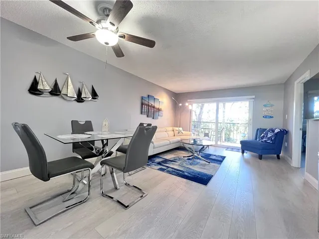 a living room with furniture rug and window