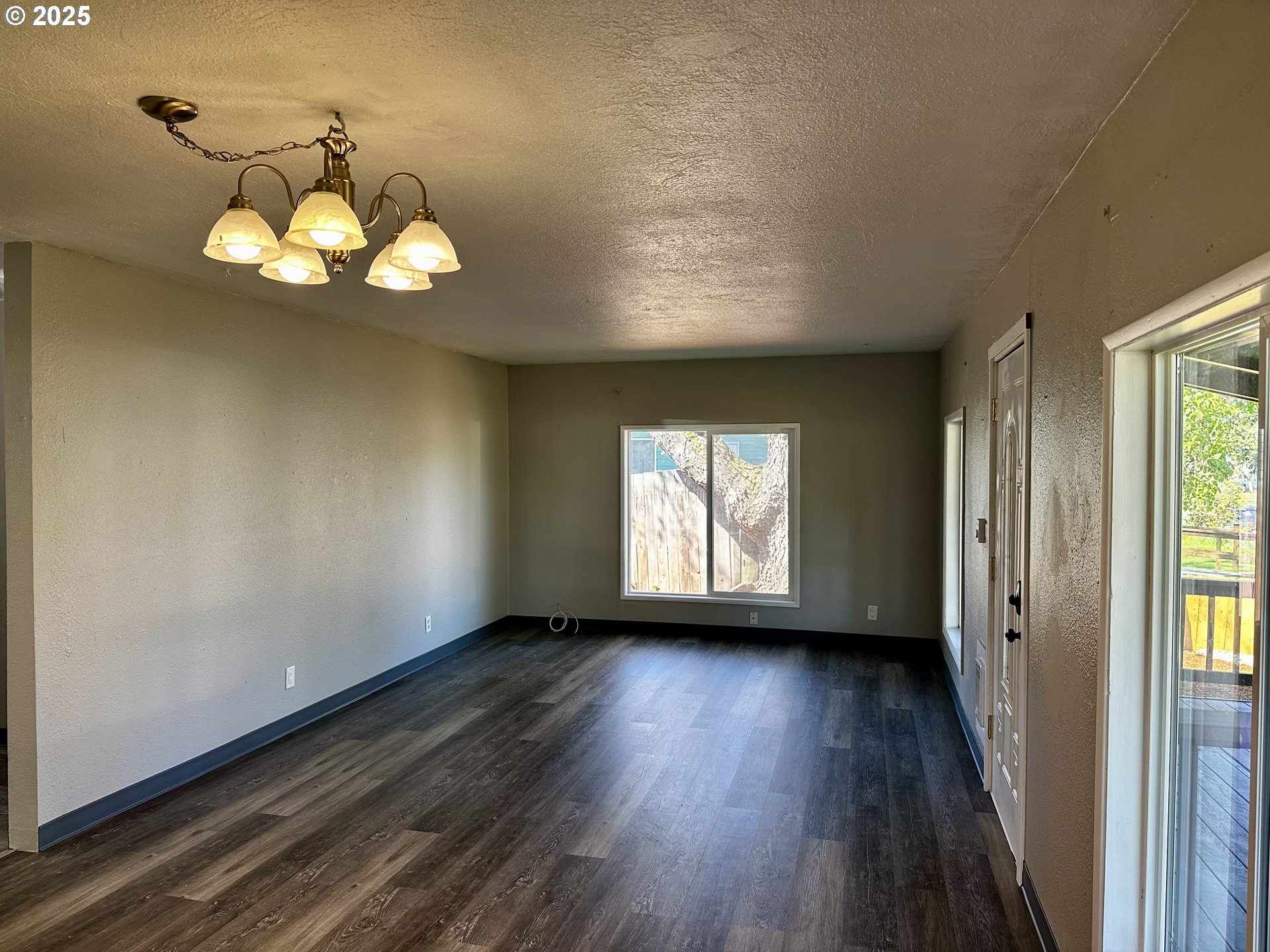 1733 I Street Springfield, OR 97477 - Photo 17 of 28 a view of an empty room with wooden floor and a window