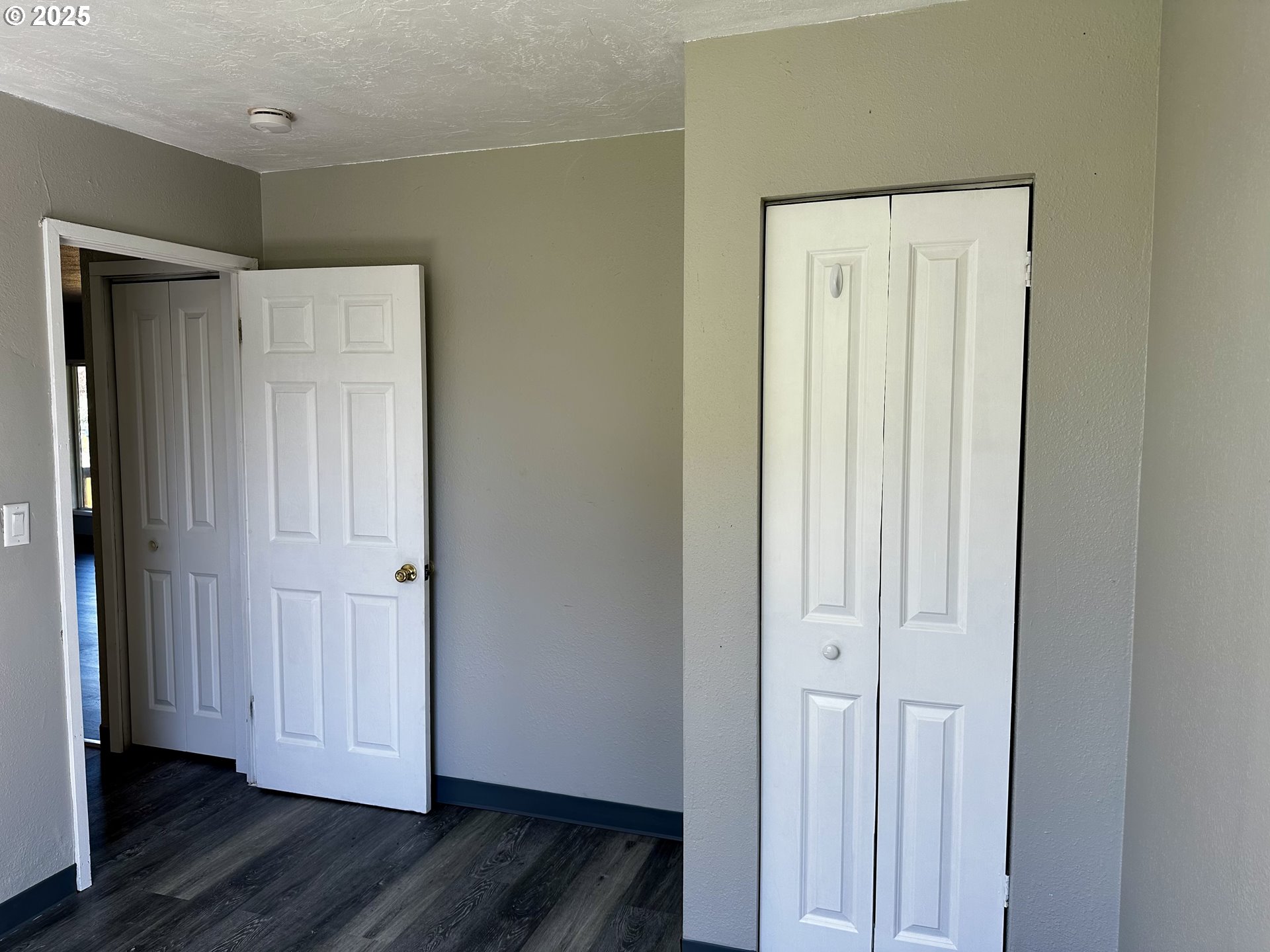 1733 I Street Springfield, OR 97477 - Photo 22 of 28 a view of a hallway with wooden floor