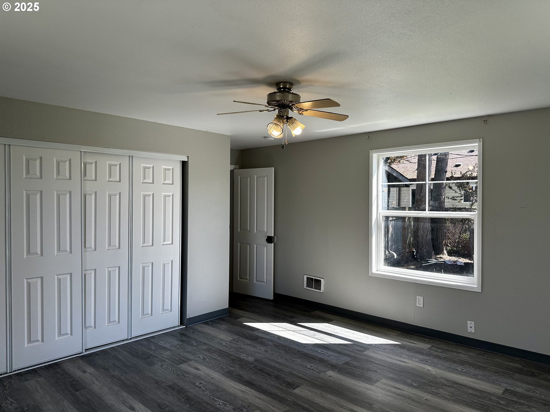 1733 I Street Springfield, OR 97477 - Photo 24 of 28 wooden floor in an empty room with a window
