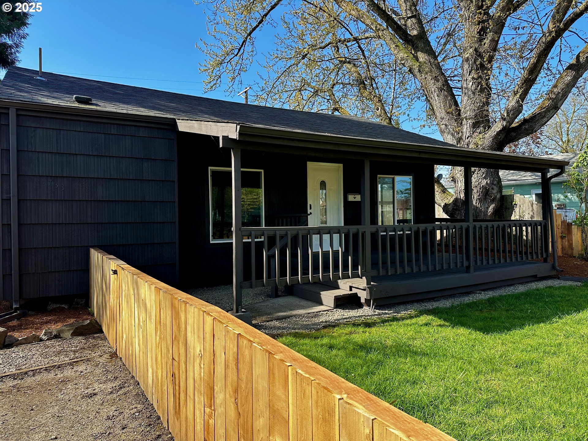 1733 I Street Springfield, OR 97477 - Photo 10 of 28 a view of a house with wooden floor and a fence