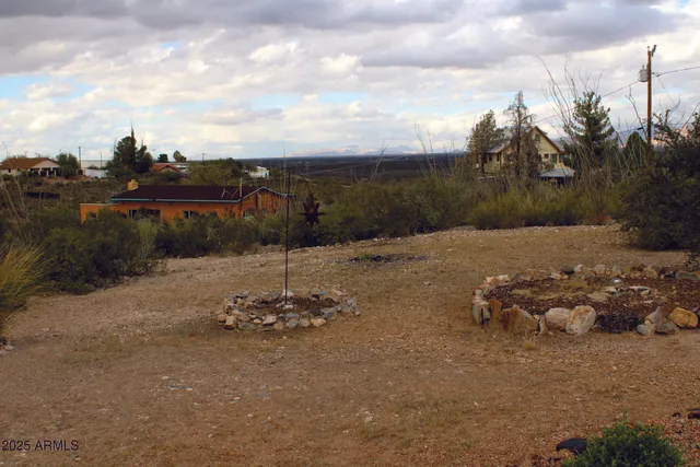 a view of a hallway with wooden floor and closet