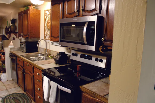 a bedroom with a bed and a chair