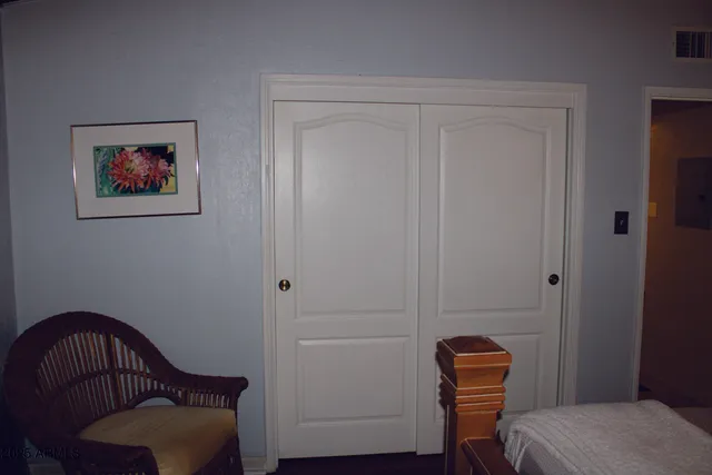 a view of a kitchen with granite countertop a sink and a stove with wooden floor