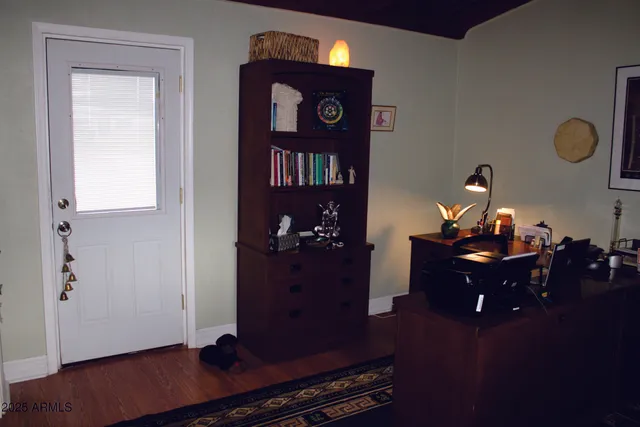a view of entryway with wooden floor
