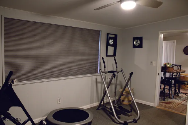 a backyard of a house with wooden stairs and stairs