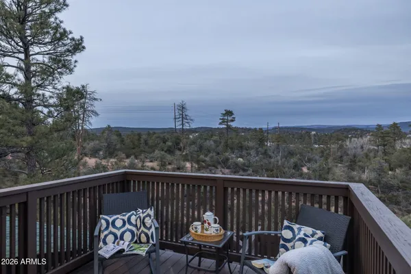 a view of a two chairs on the roof deck