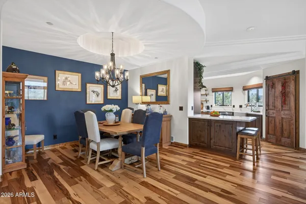 a view of a dining room with furniture window and wooden floor