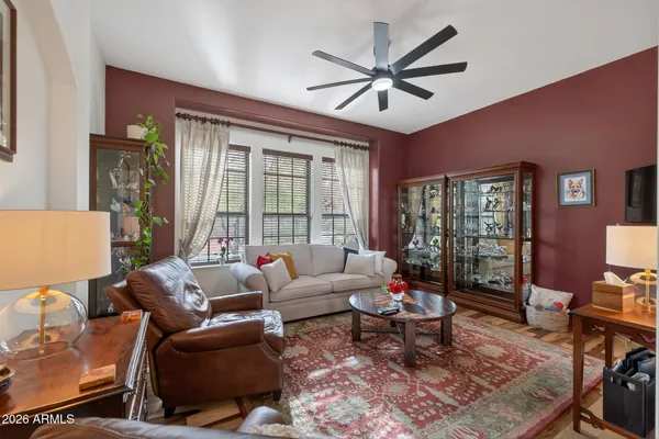 a living room with furniture and a large window