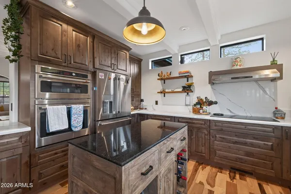 a utility room with sink dryer and washer