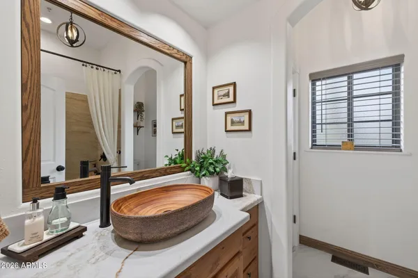 a view of a patio with dining table and chairs
