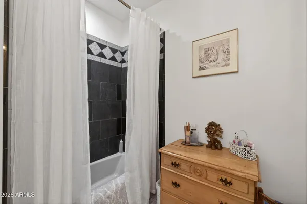 a sitting area with furniture and wooden floor
