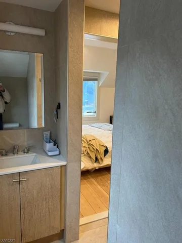 a en suite bathroom with a sink and vanity