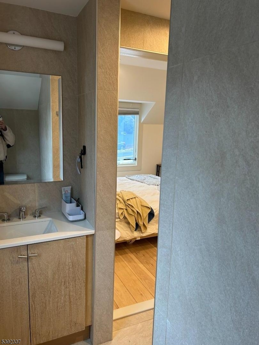 57 Baltusrol Road Summit, NJ 07901 - Photo 14 of 30 a en suite bathroom with a sink and vanity