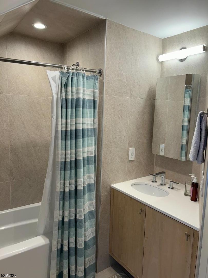 57 Baltusrol Road Summit, NJ 07901 - Photo 19 of 30 a bathroom with a sink and a mirror