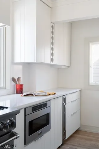 a utility room with sink dryer and washer