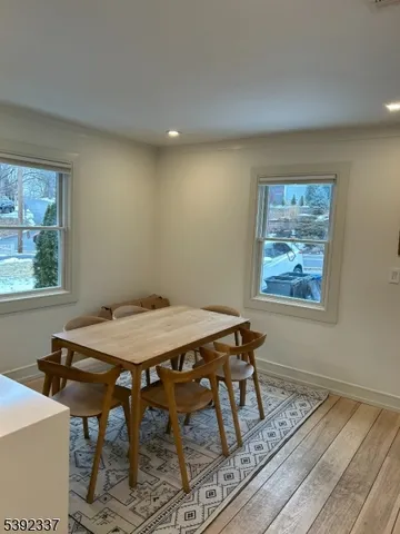 a view of a dining table and chairs in a room