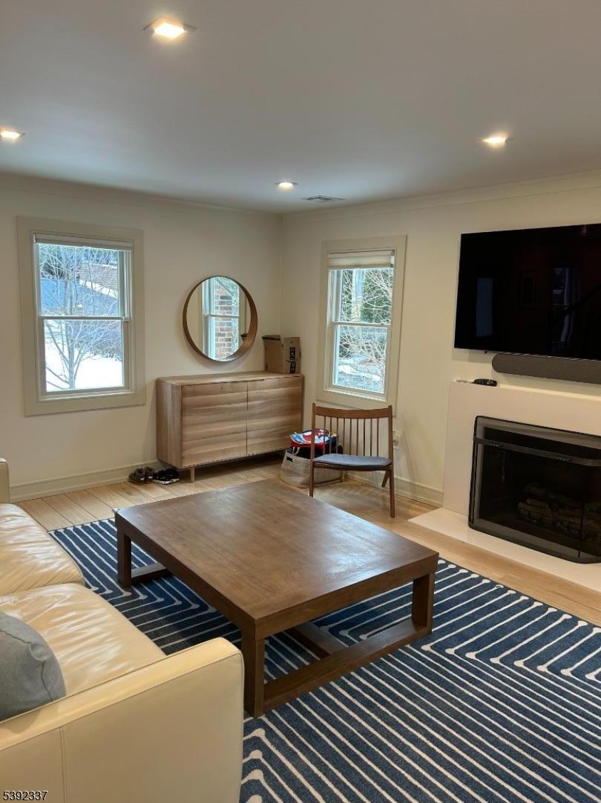 57 Baltusrol Road Summit, NJ 07901 - Photo 8 of 30 a living room with furniture and a flat screen tv